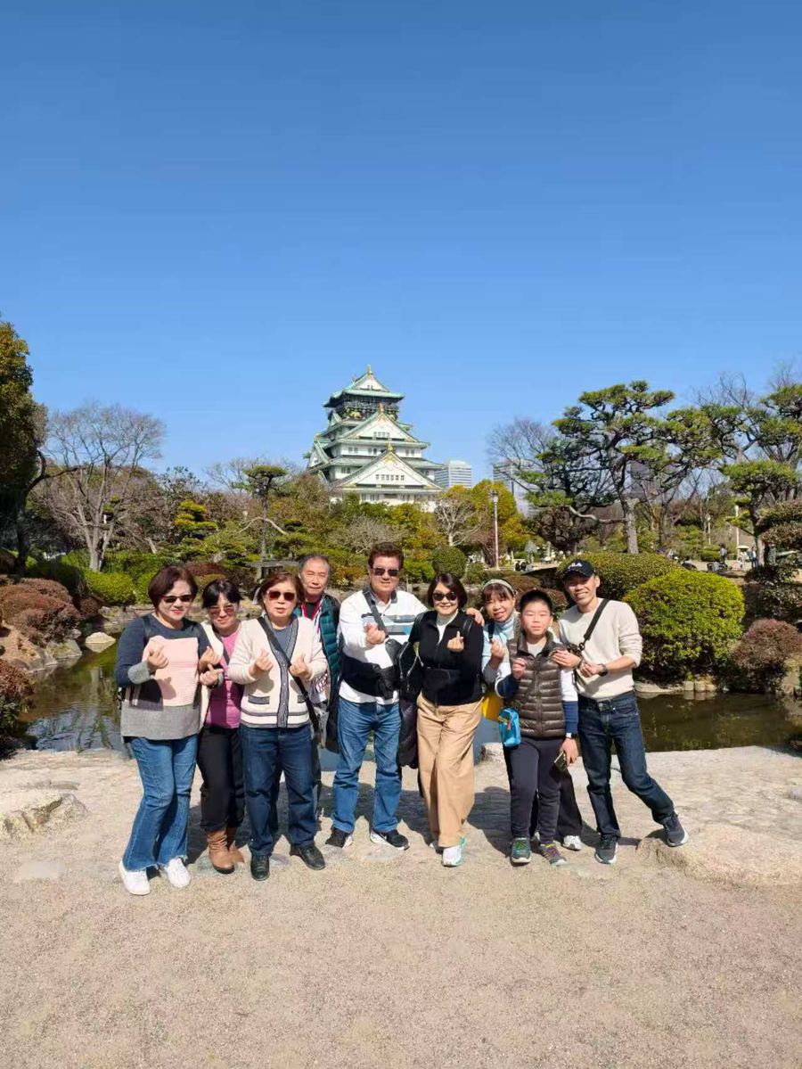 Group in the garden below Osaka Castle