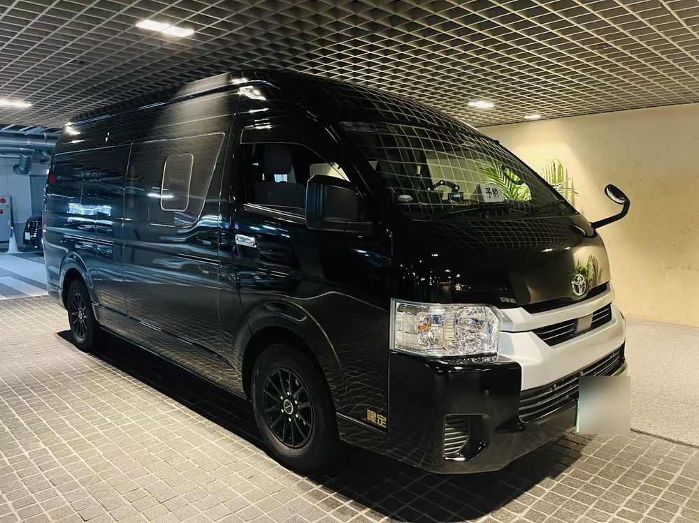 Black high-roof Toyota Hiace van