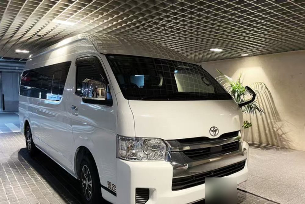 White Toyota Hiace Grand Cabin high-roof van